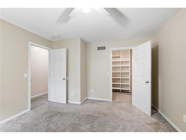 Primary bedroom with the walk-in closet