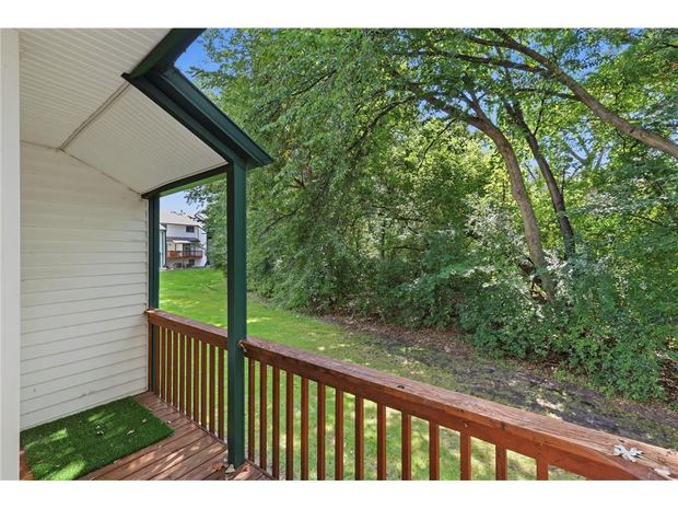 Deck off the main level looking into the trees