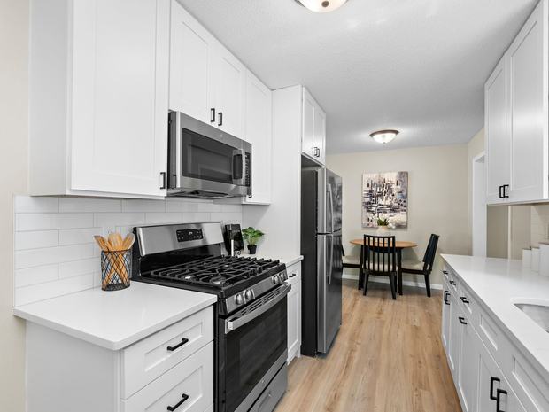 Kitchen with quartz counters and subway tile