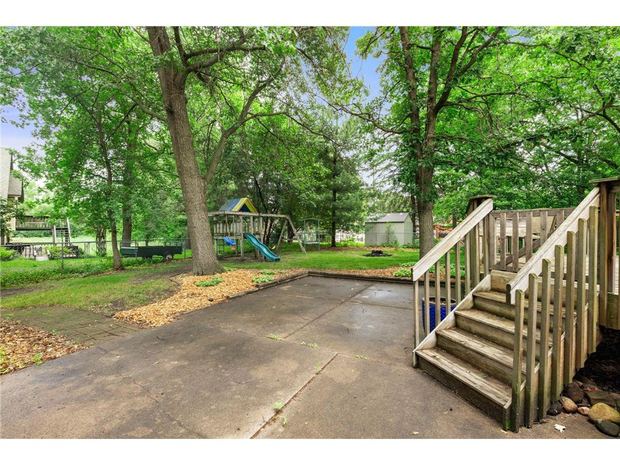 The back yard, the patio and the play set