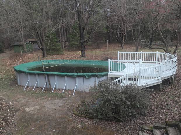 Above ground pool and deck in the back yard