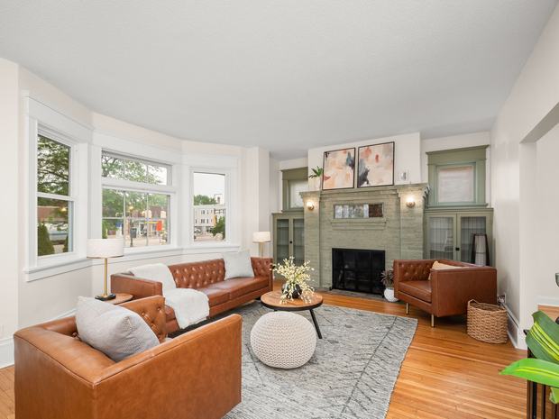 Living room with the fireplace and bay window