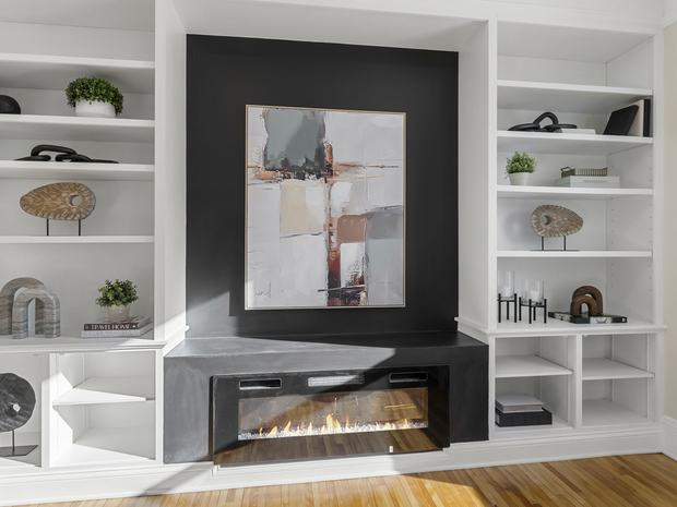 Living room fireplace with built-in shelving