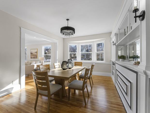 Dining room with built-in buffet and bay window