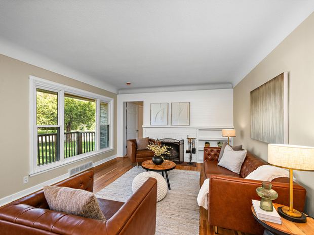 Living room with the fireplace and original hardwoods