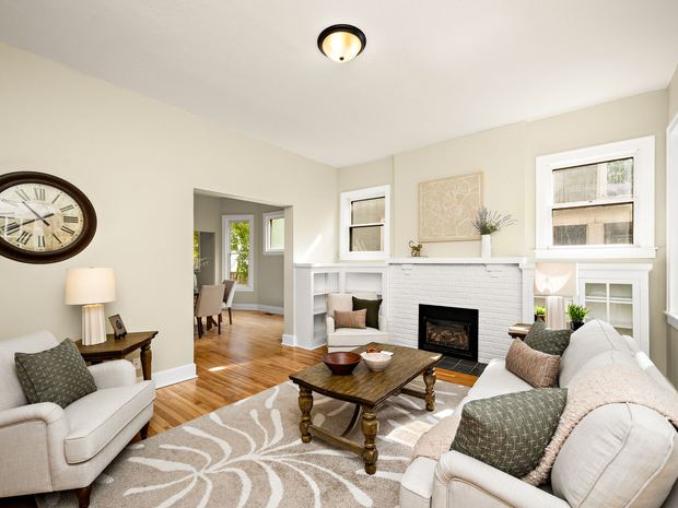 Lower unit living room with the original fireplace