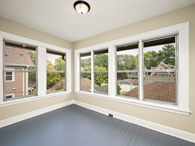 Upper unit corner windows above the treetops