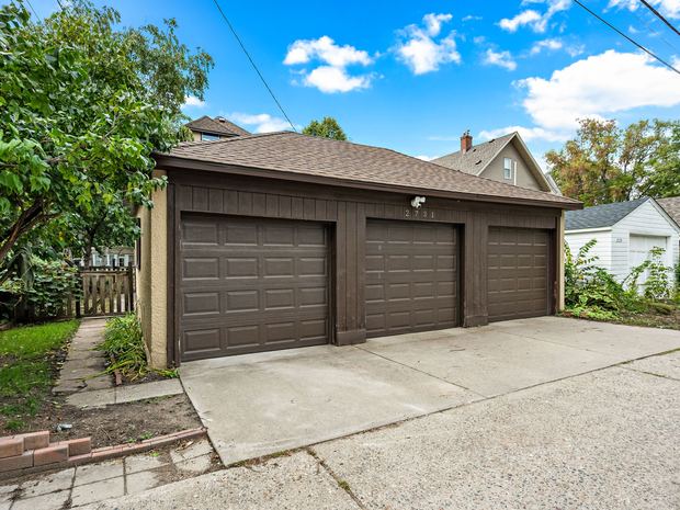 Three car detached garage with individual stalls