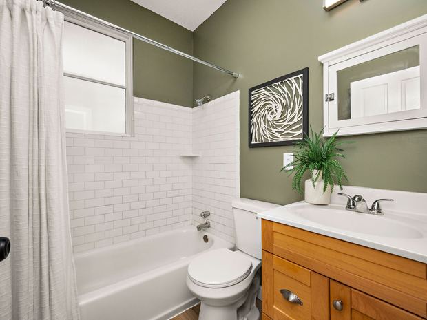 The lower unit bathroom, tub and subway tile
