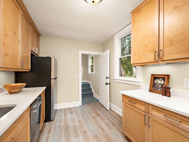 Lower unit kitchen and the door to the stairs