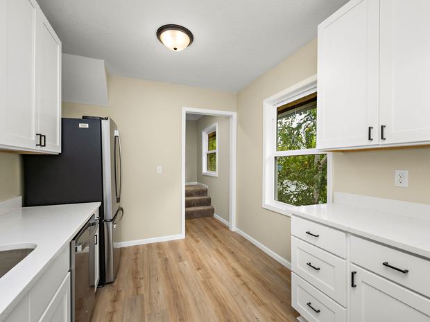 Upper unit kitchen and the stairs to the third floor