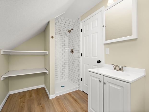 Third floor bathroom with a tiled shower