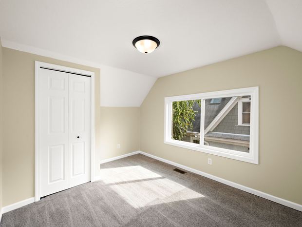 Third floor bedroom with a closet