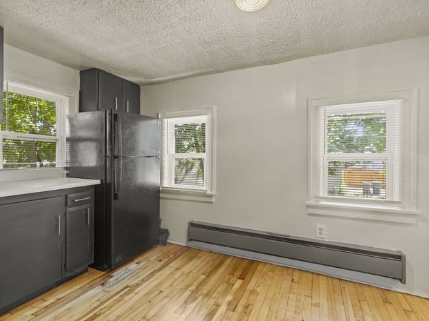 Kitchen with hardwood and the refrigerator