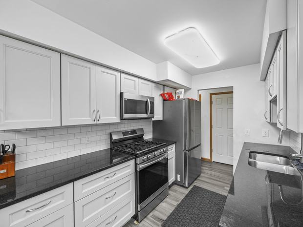 Updated kitchen with granite and stainless