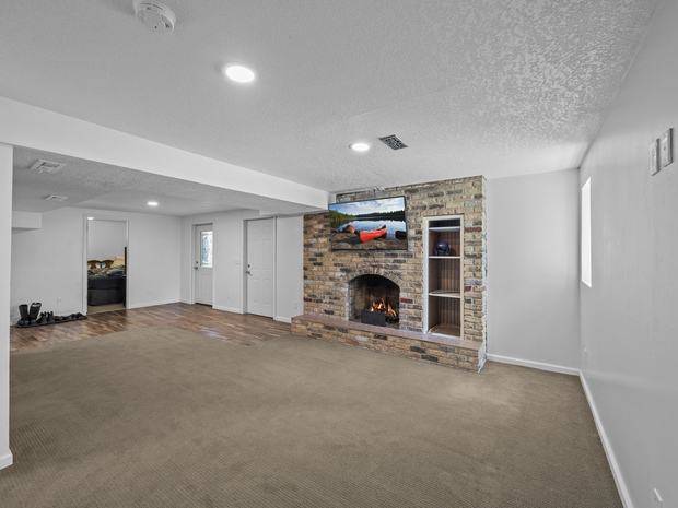 Lower level family room with the second fireplace
