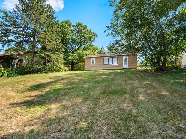 The house across the open yard