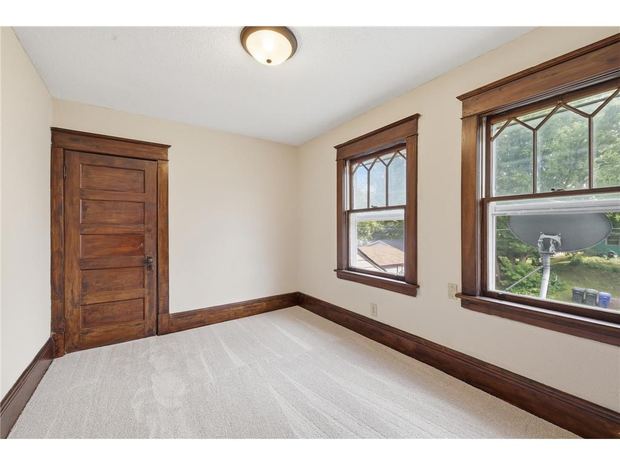 Room with the arched window and original trim