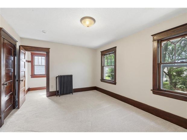 A room with the original dark wood trim